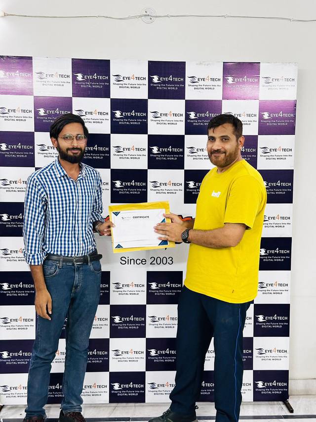 An Eye4Tech engineer receiving a certificate of recognition
